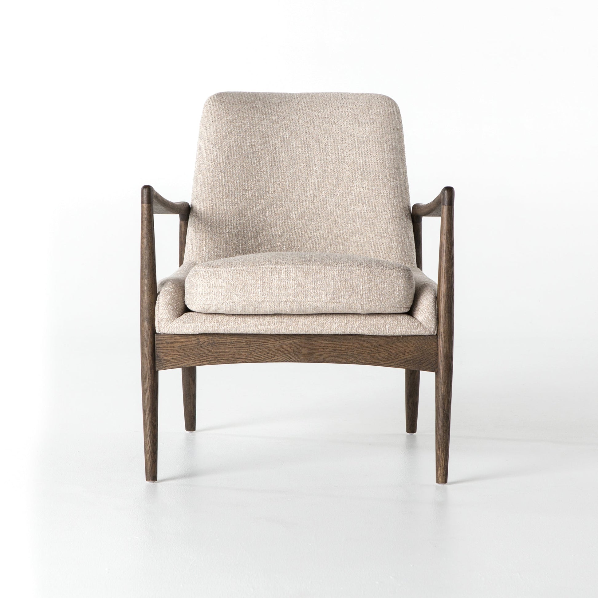 cream fabric mid century modern arm chair with wooden arms and legs