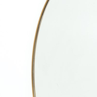 large brass framed round mirror