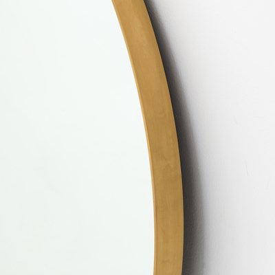 large brass framed round mirror