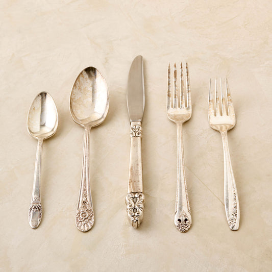 magnolia vintage flatware set including fork, knife, and spoon