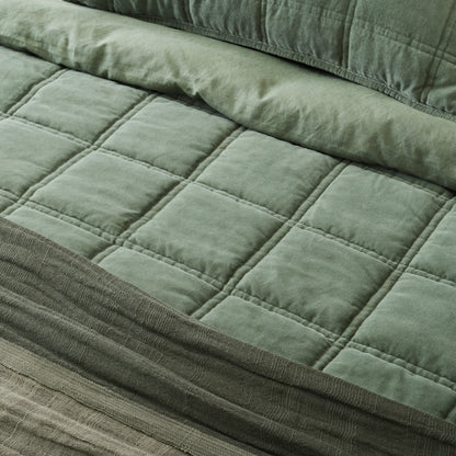 Weekend Velvet Quilt - Dusty Green on a made bed