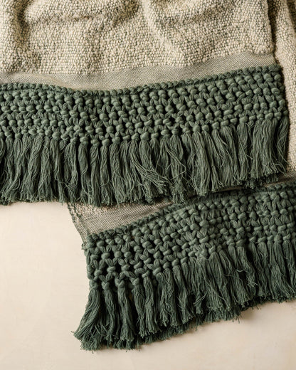Close up of Dusty Green Tassel Throw dark green tassels