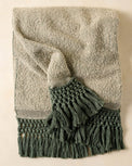 Dusty Green Tassel Throw with dark green tassels 
