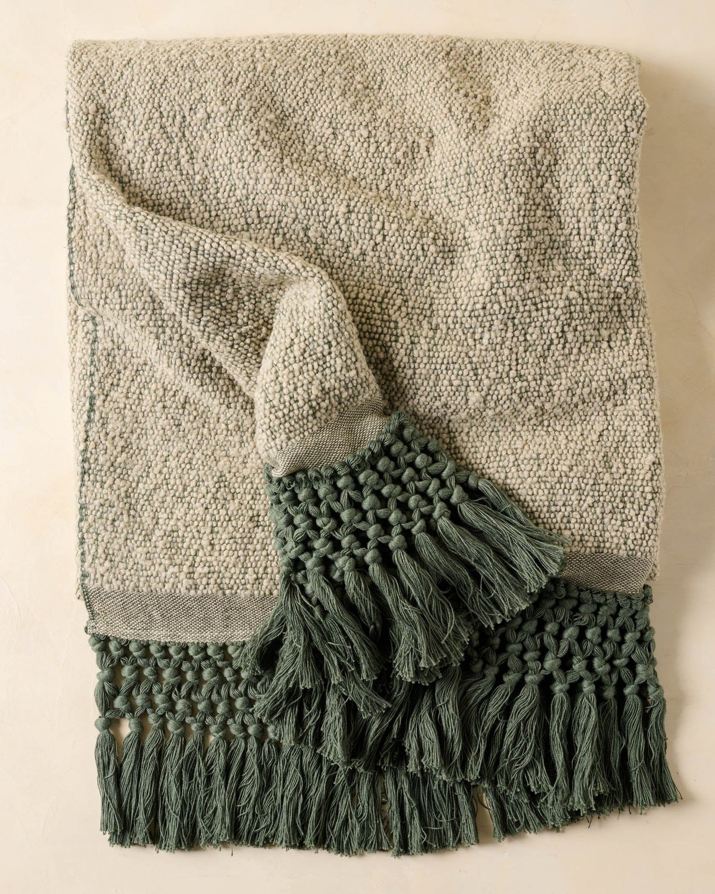 Dusty Green Tassel Throw with dark green tassels 