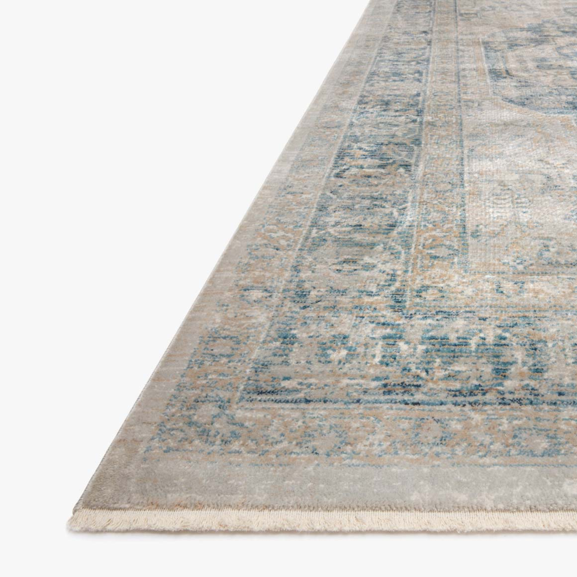 beige and blue traditional area rug with floral detail