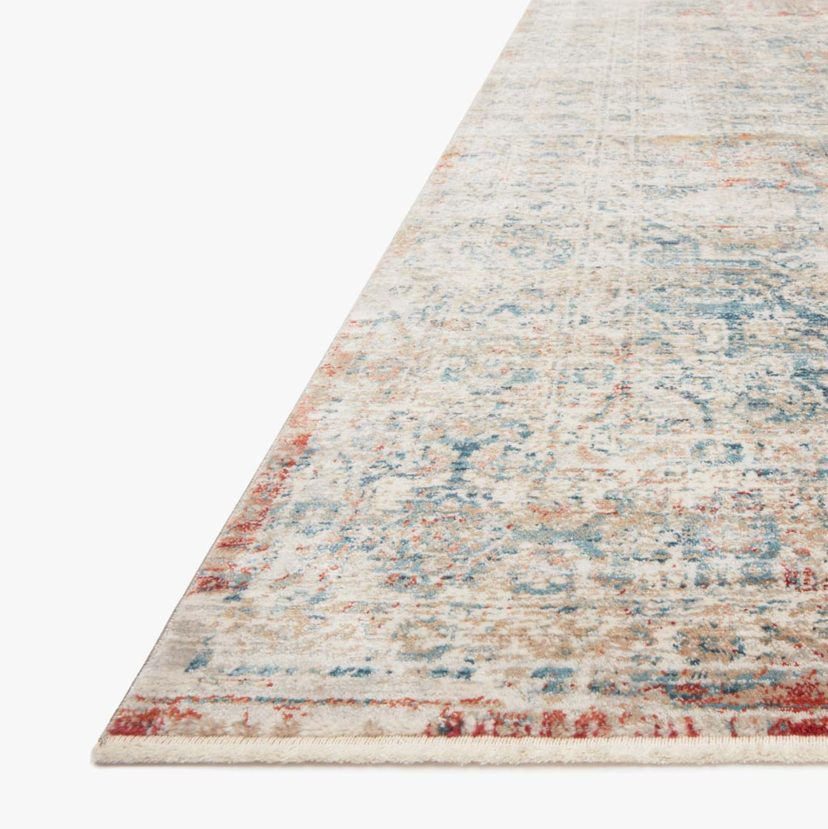 distressed multi-colored traditional area rug with floral detail