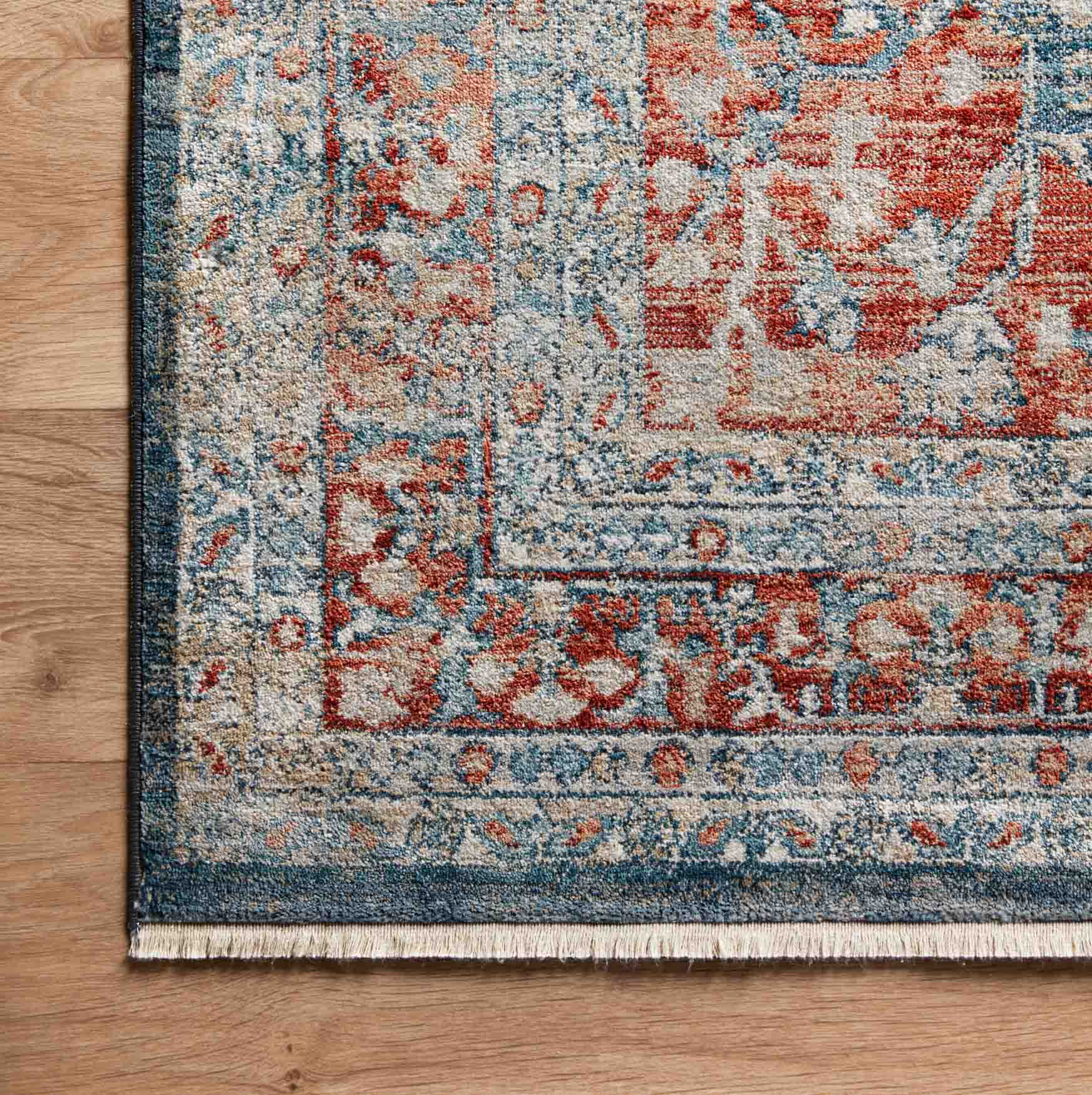 navy and red traditional area rug with floral detail