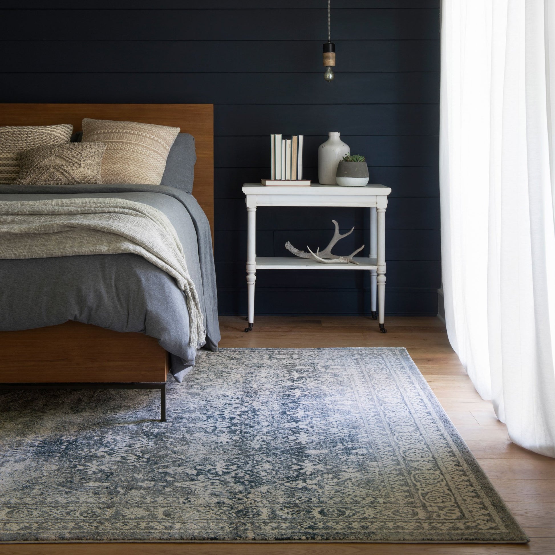 dark grey distressed rug with floral pattern