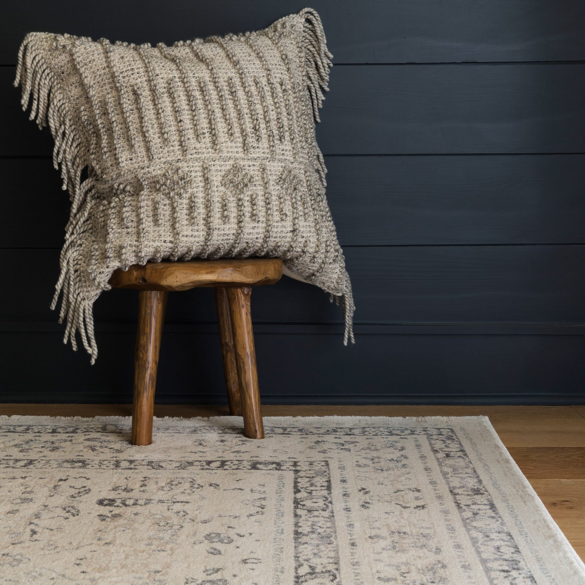ivory and tan distressed rug with floral detail