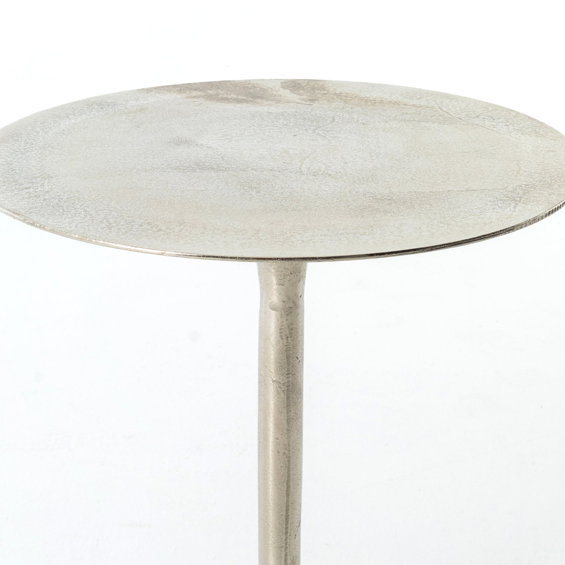 metal end table with raw nickel finish