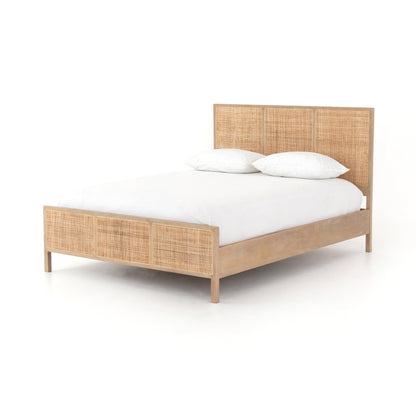 modern natural washed wooden bed with cane detailed headboard and footboard