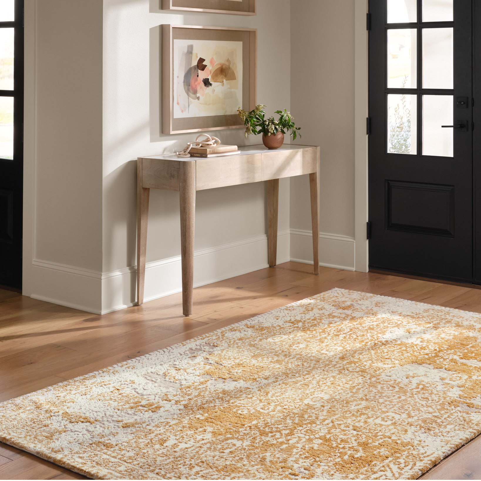 golden yellow distressed area rug with floral detail
