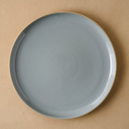 Lakelynn plate with a glazed blue gray interior and a tan exterior in dinner plate size