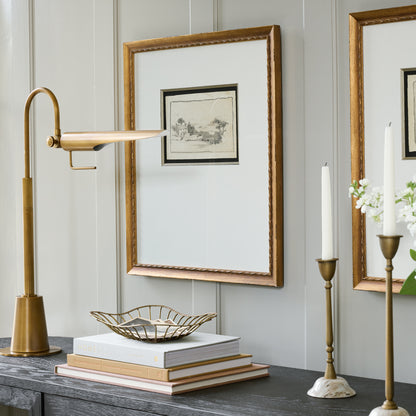 Linear Natural Brass Task Lamp on sideboard