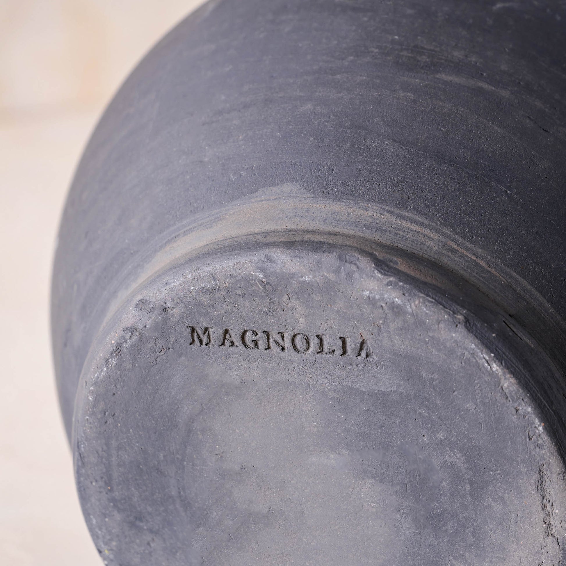 Magnolia logo embossed on the bottom of Rustic Black Hand-Made Vase