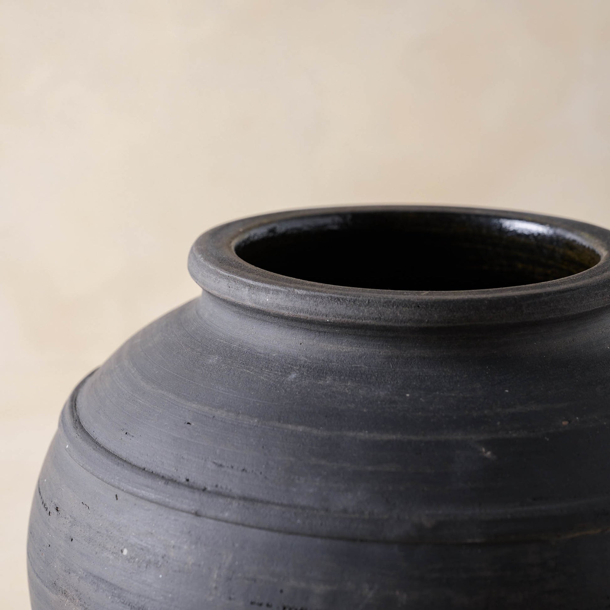 Close up of the top of Rustic Black Hand-Made Vase