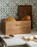 Magnolia Antiqued Wood Storage Box on counter containing bread