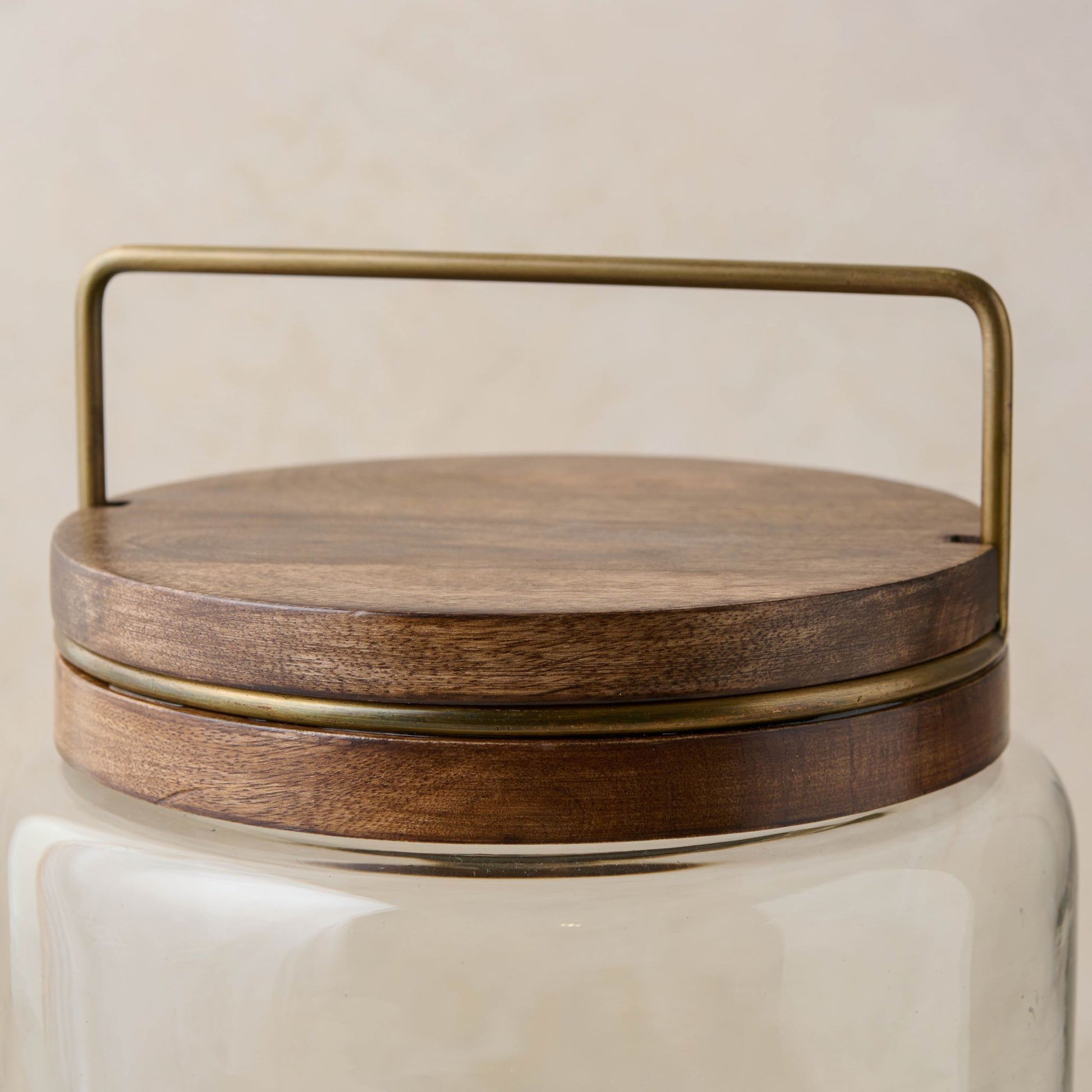 magnolia glass canister with wood and antique brass lid