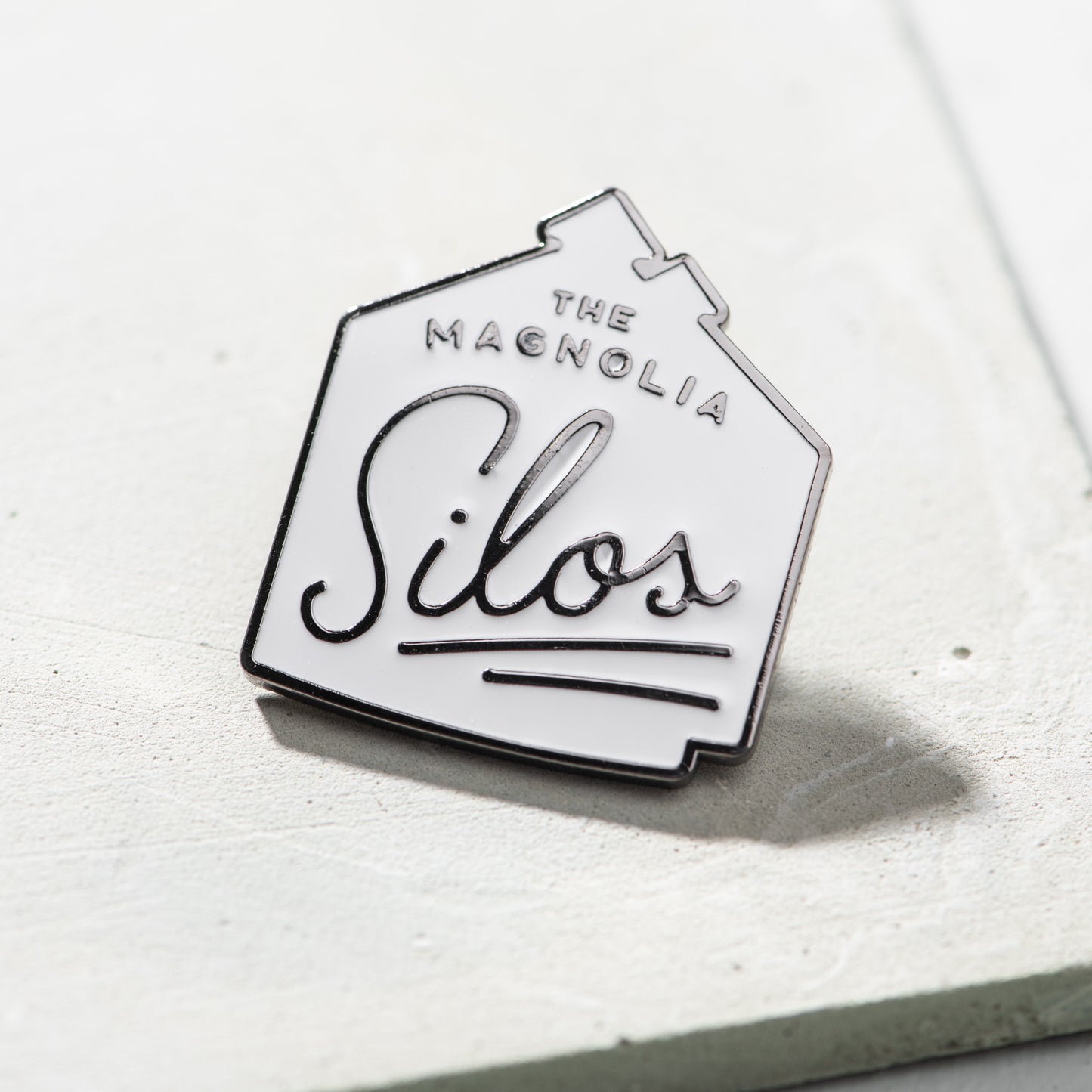 branded magnolia silos enamel pin