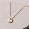 magnolia gold initial disc necklace