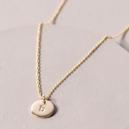 magnolia gold initial disc necklace