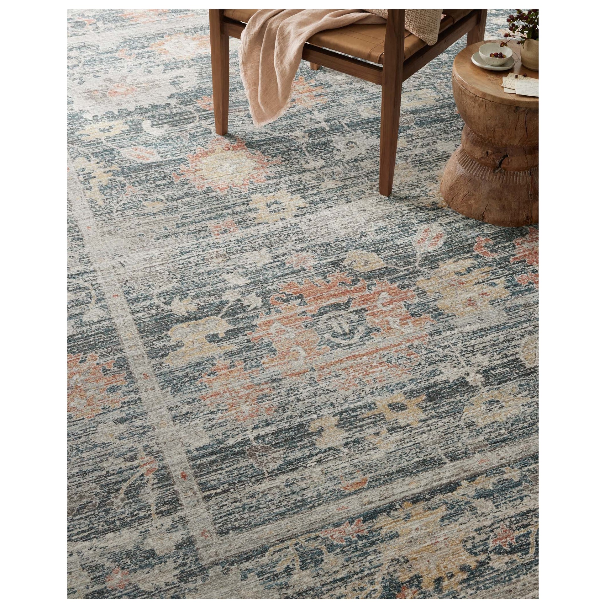 Millie Blue Multi Rug under a chair