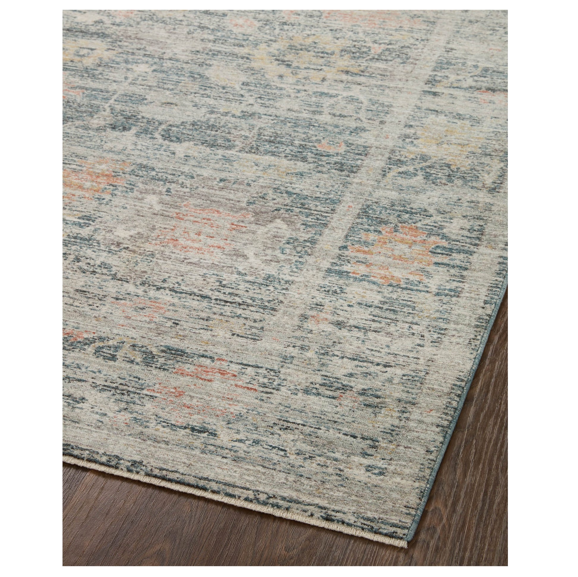 Millie Blue Multi Rug corner on wood floor 