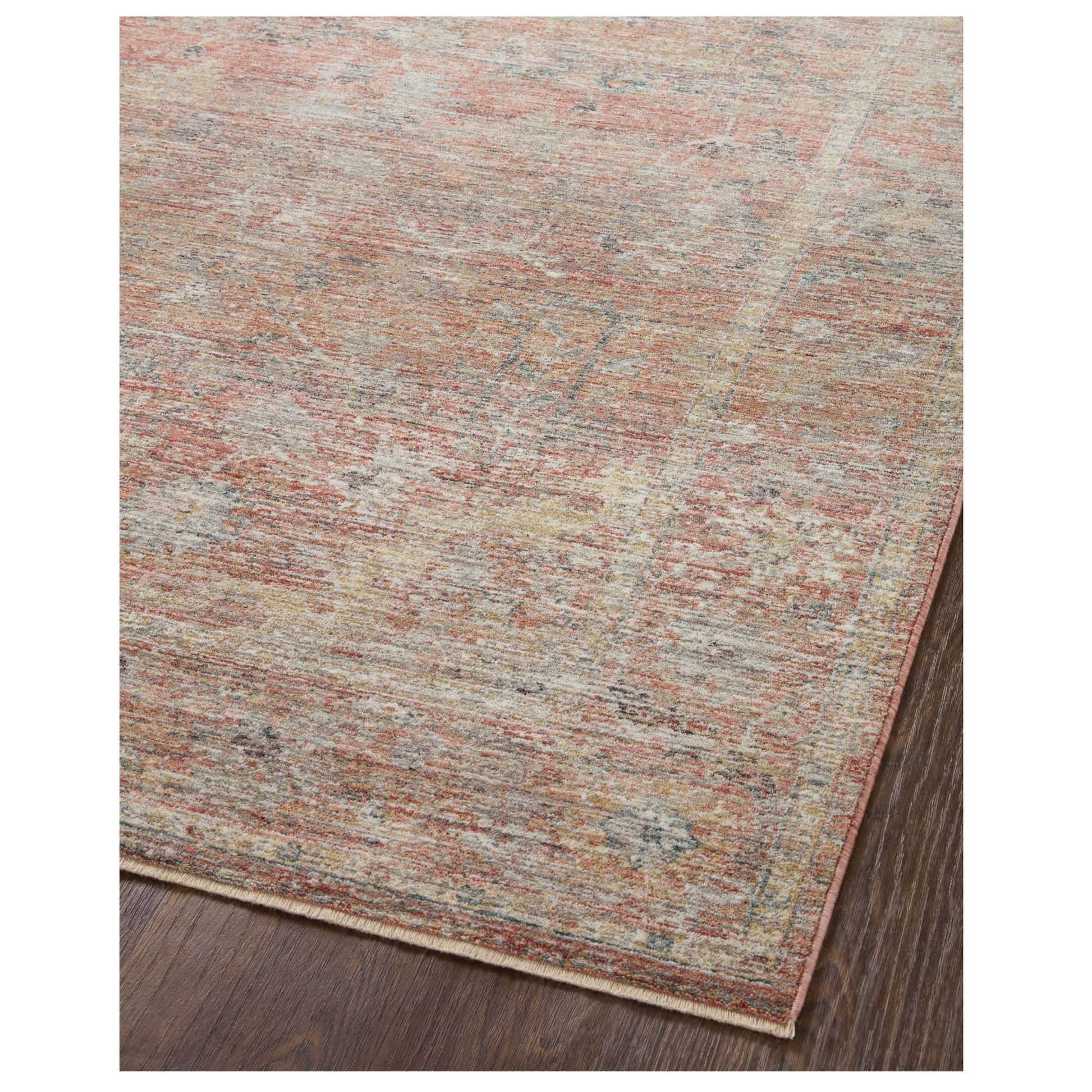 Millie Sunset Multi Rug corner on wood floor