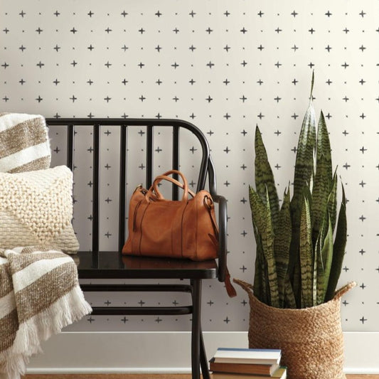 cream wallpaper with black plus sign and x pattern