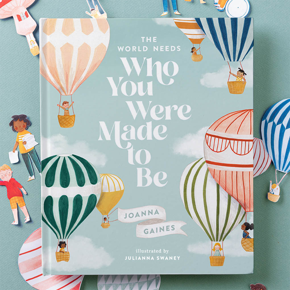 A children's book titled "The world needs who you were made to be" by Joanna Gaines