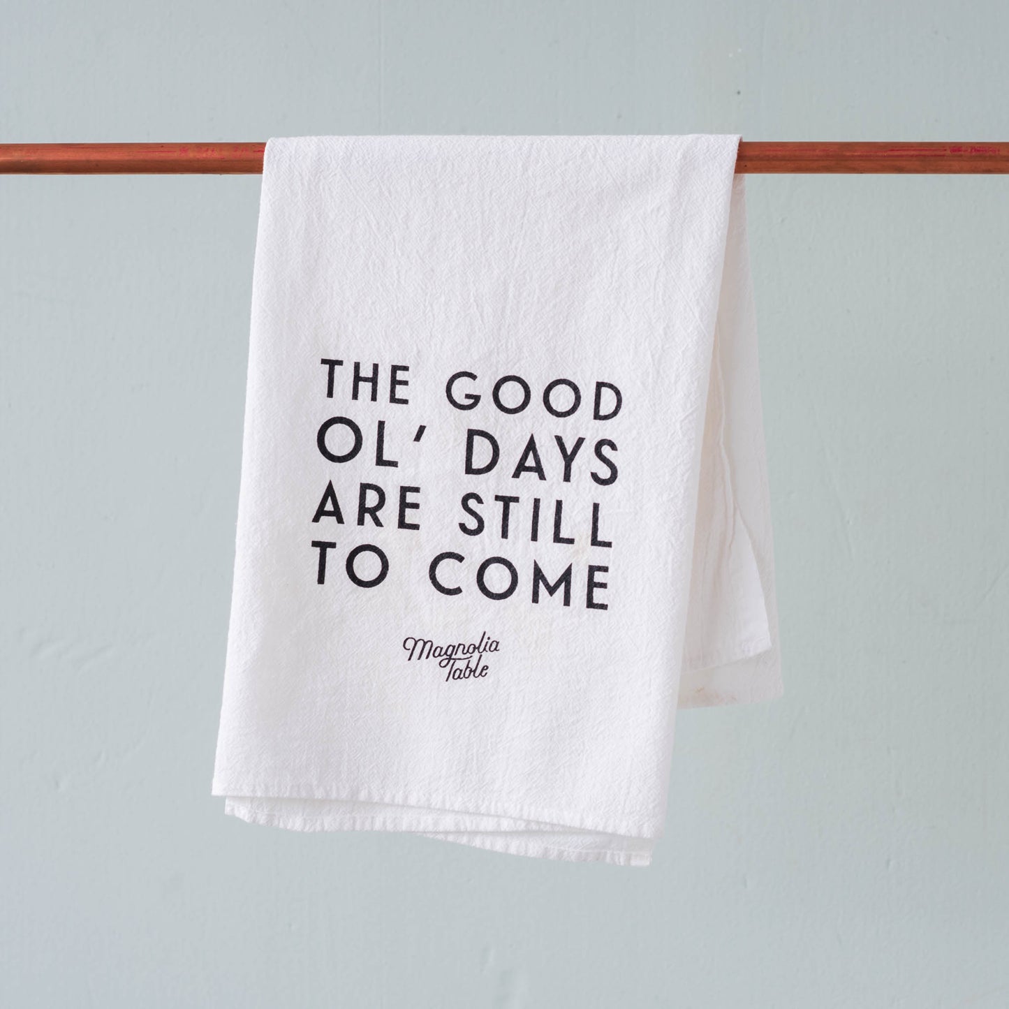 magnolia table restaurant branded tea towel with quote "The good ol days are still to come"