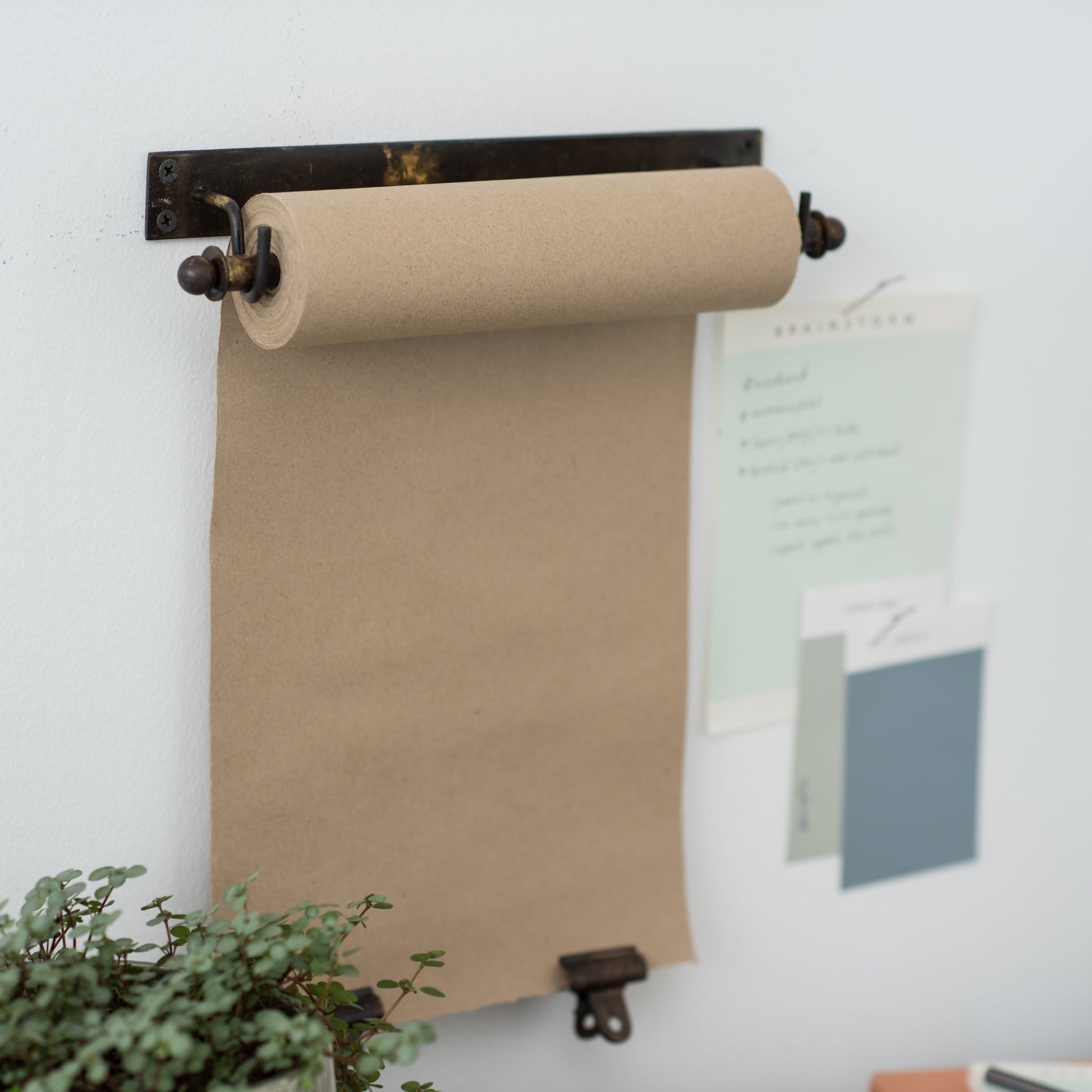 hanging black metal bracket and paper scroll