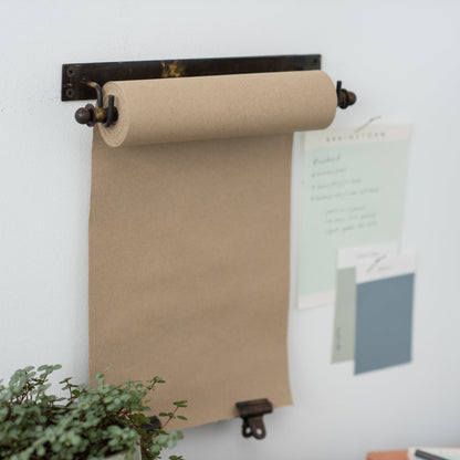 hanging black metal bracket and paper scroll