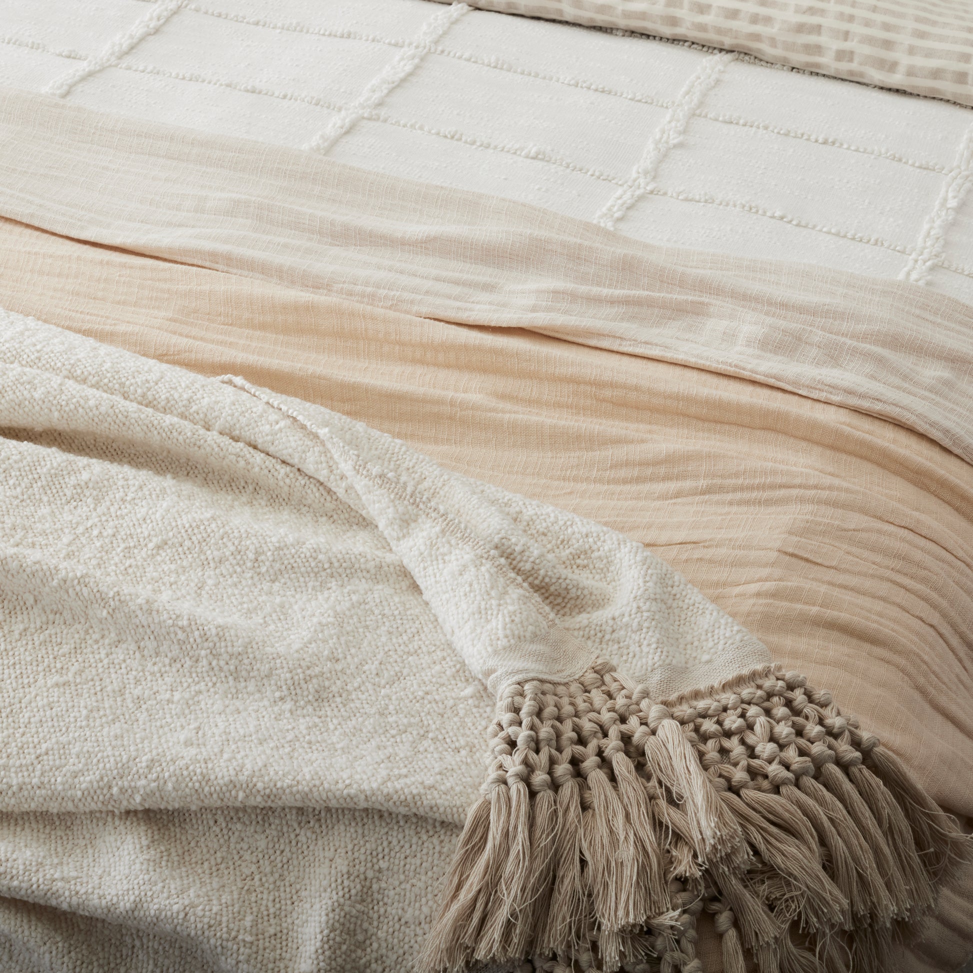 Angora Tassel Throw on the foot of a bed
