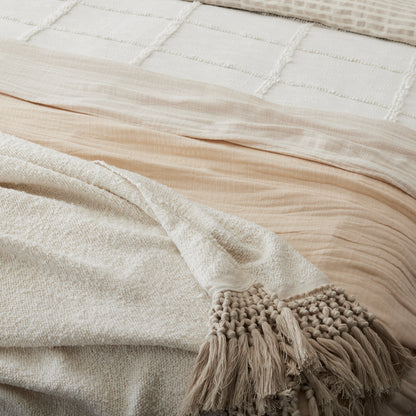 Angora Tassel Throw on the foot of a bed