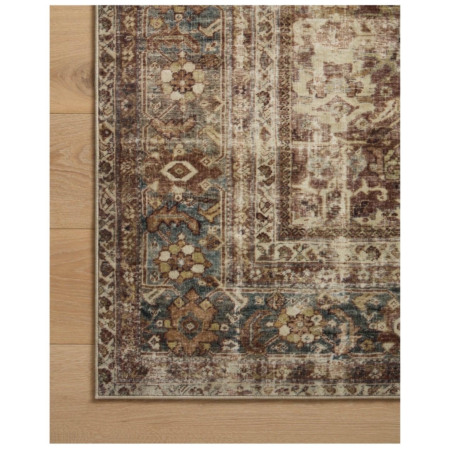 Sinclair Rust Lagoon Rug corner on wood floor