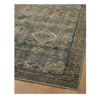 Sinclair Turquoise Multi Rug corner on wood floor