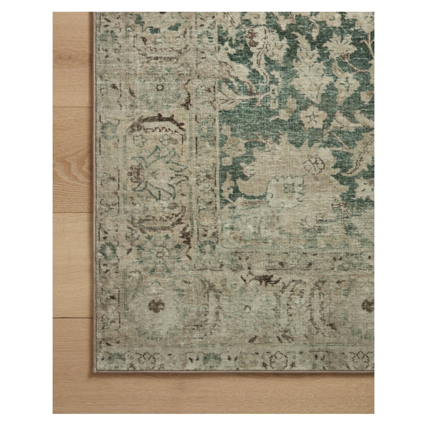 Sinclair Jade Sand Rug corner on wood floor