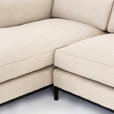 modern cream fabric sectional with left chaise with black metal base