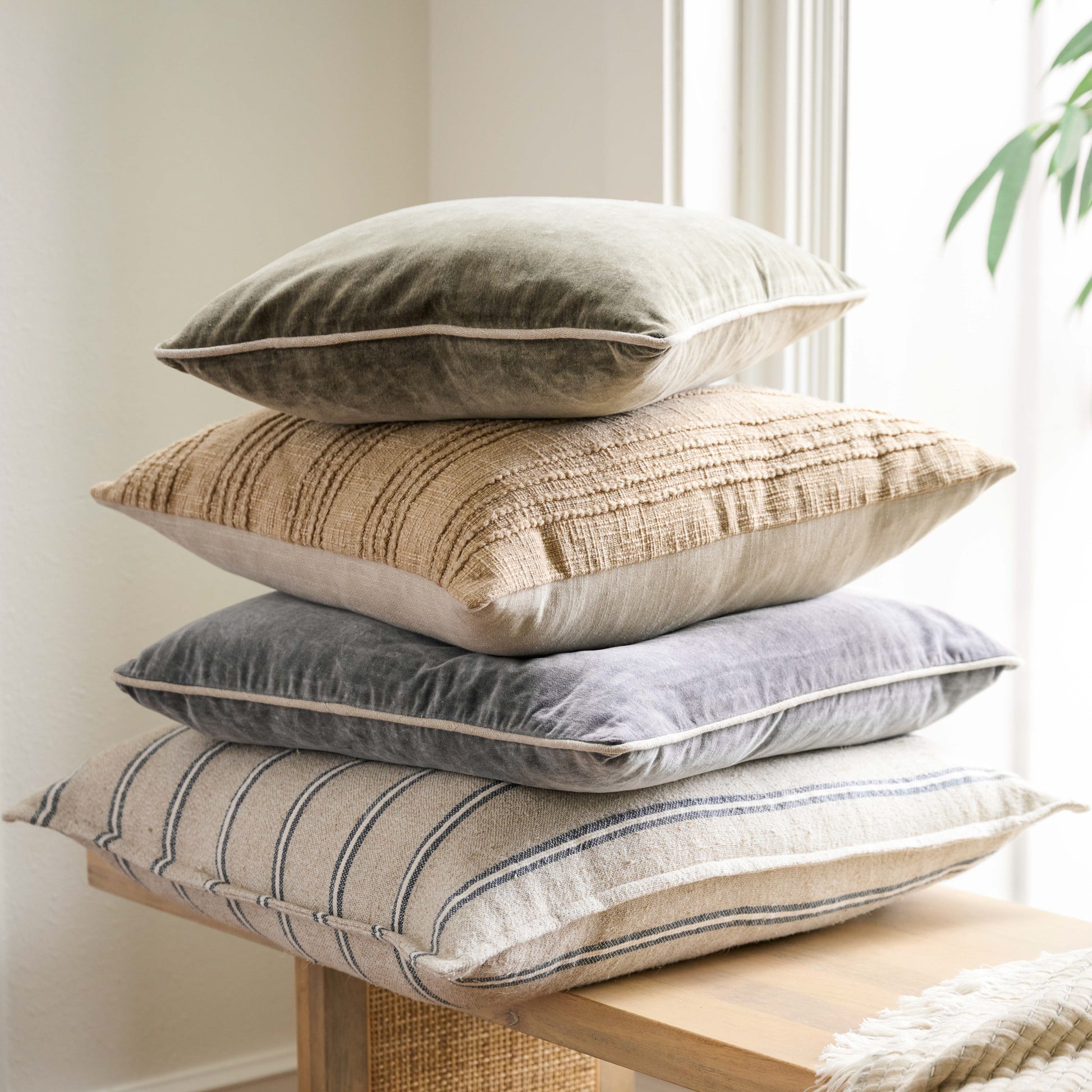 Heirloom Velvet Large Pillow stacked with other pillows