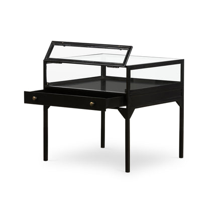 black metal end table with glass shadow box top and small drawer with brass hardware