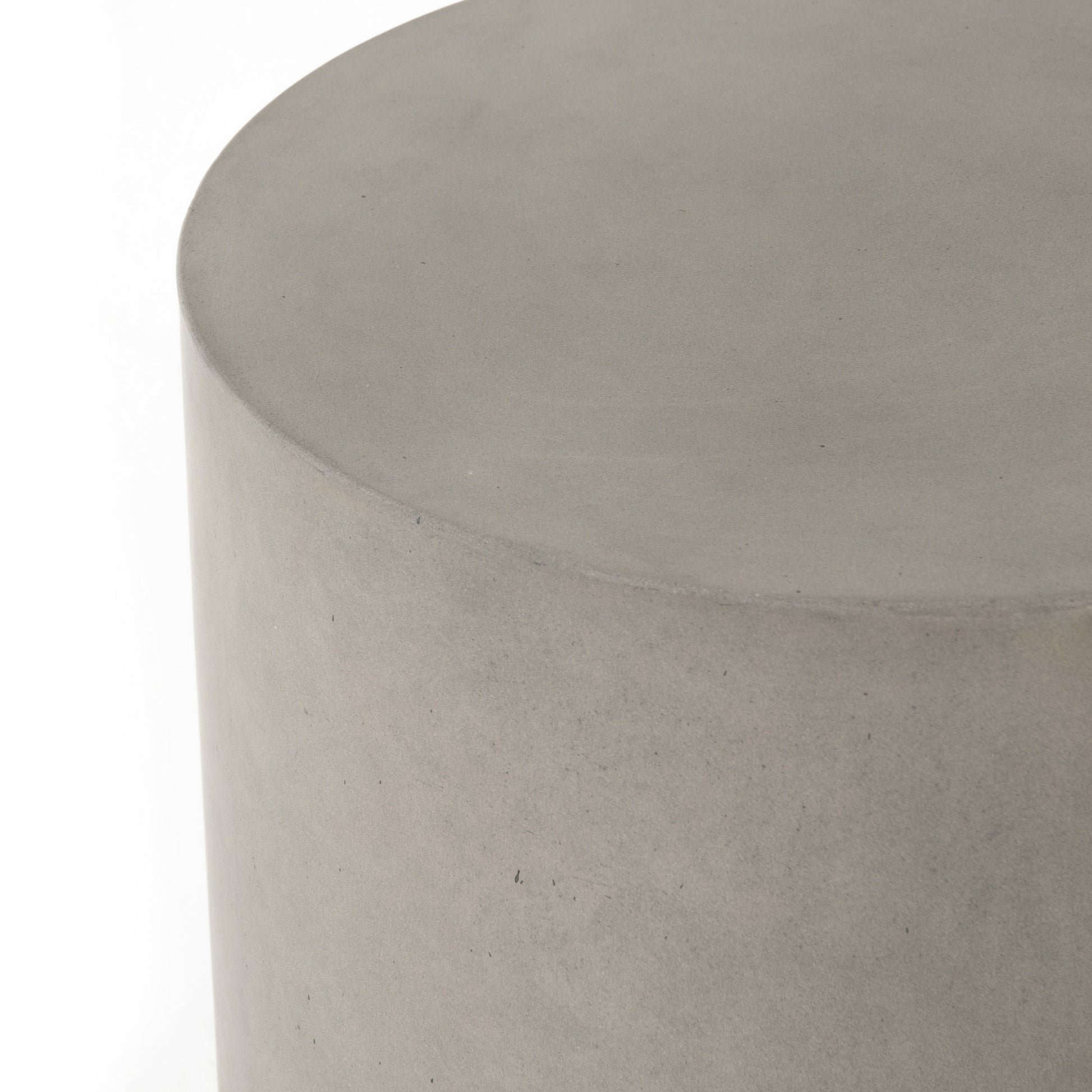 modern grey cylindrical end table with plaster finish