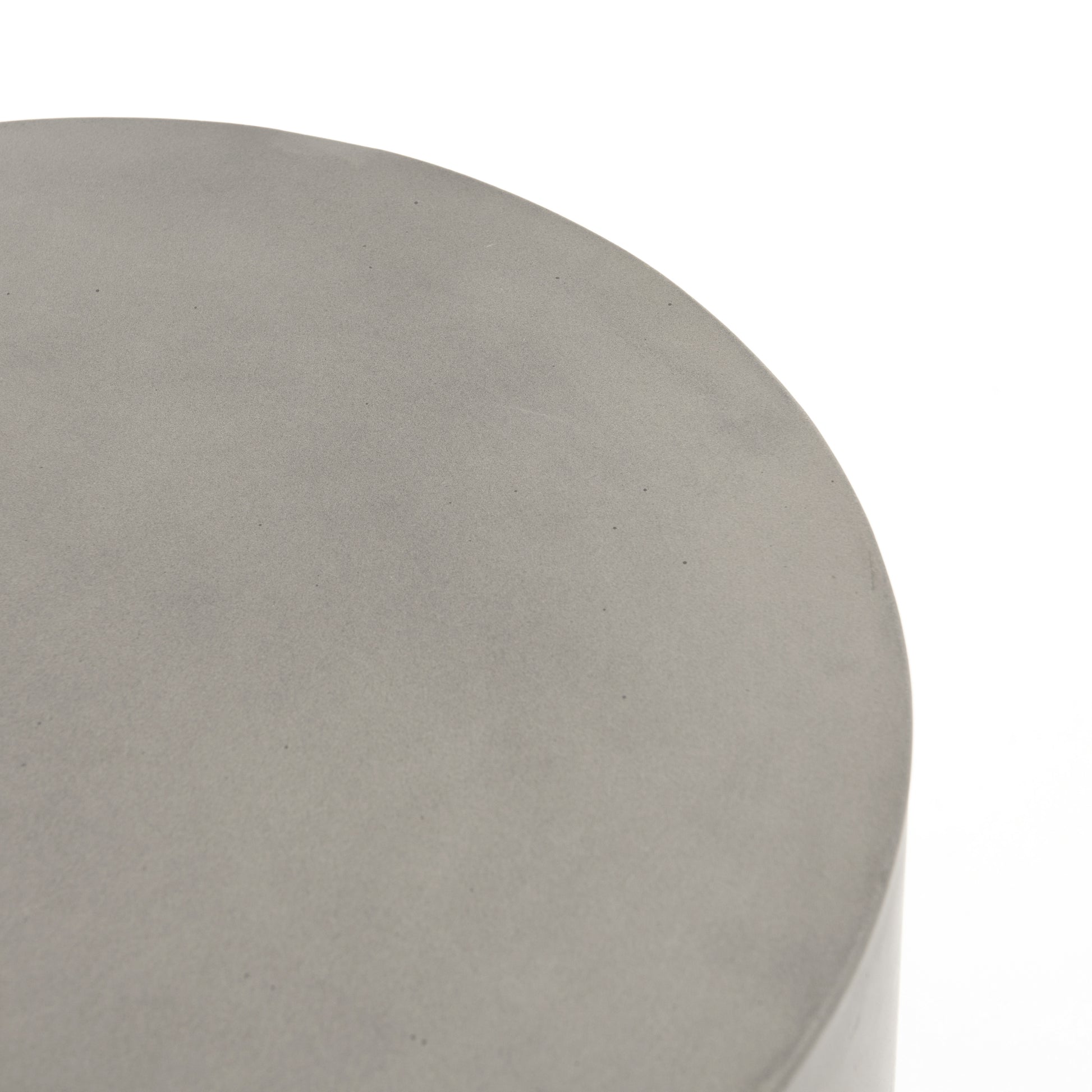 modern grey cylindrical end table with plaster finish