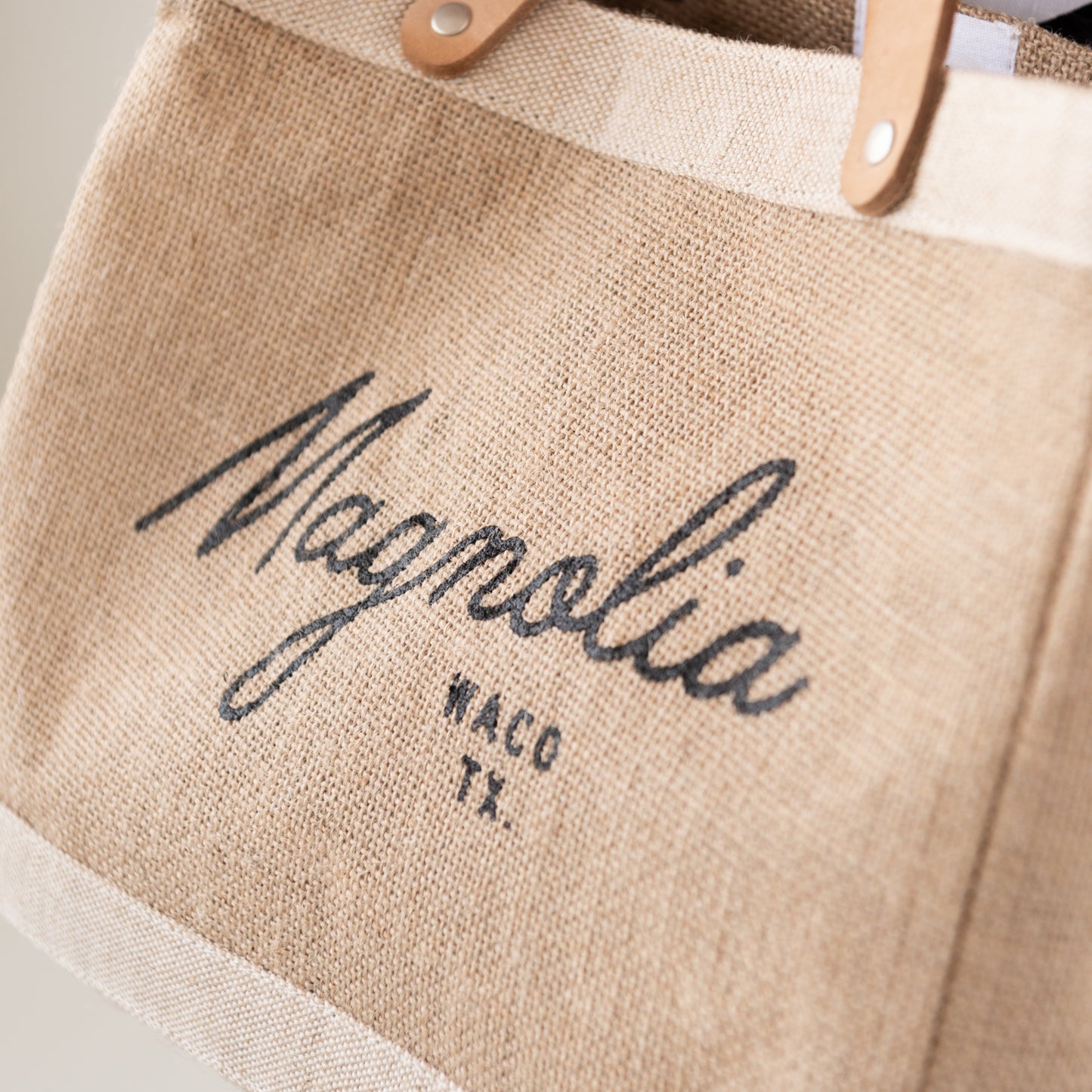 burlap tote with leather handles with Magnolia script logo