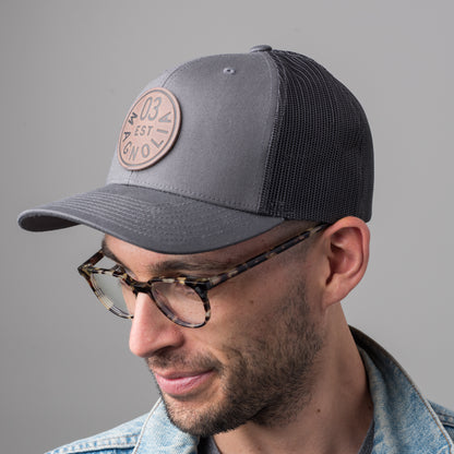 gray magnolia trucker patch with leather logo patch