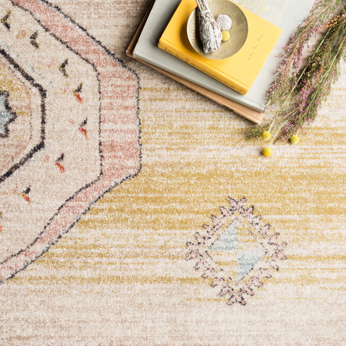cream multi-colored rug with asymmetrical patterns and detail