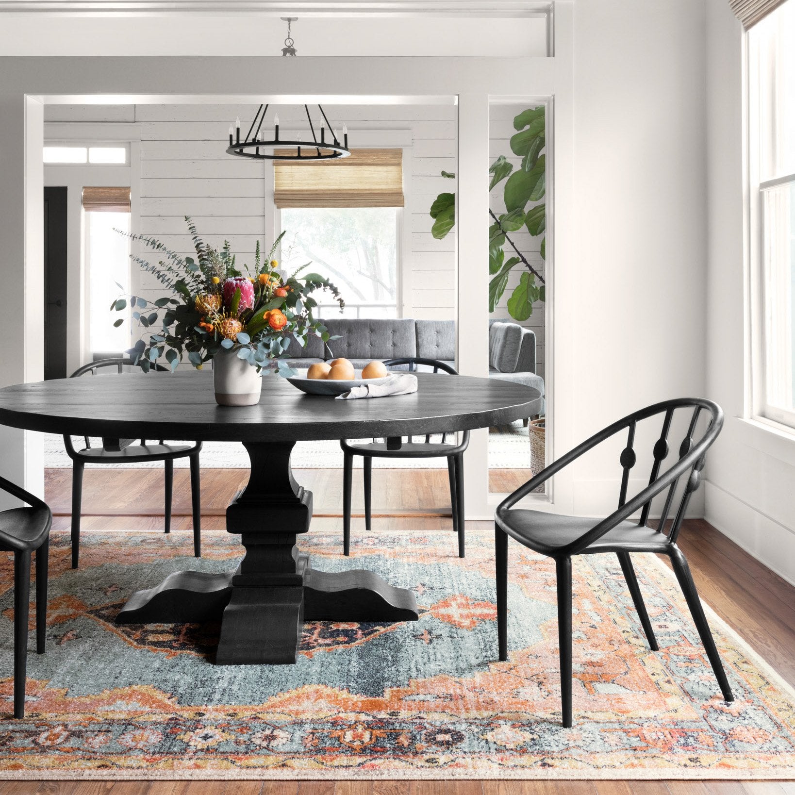 blue and orange traditional rug with multi-colored floral detail
