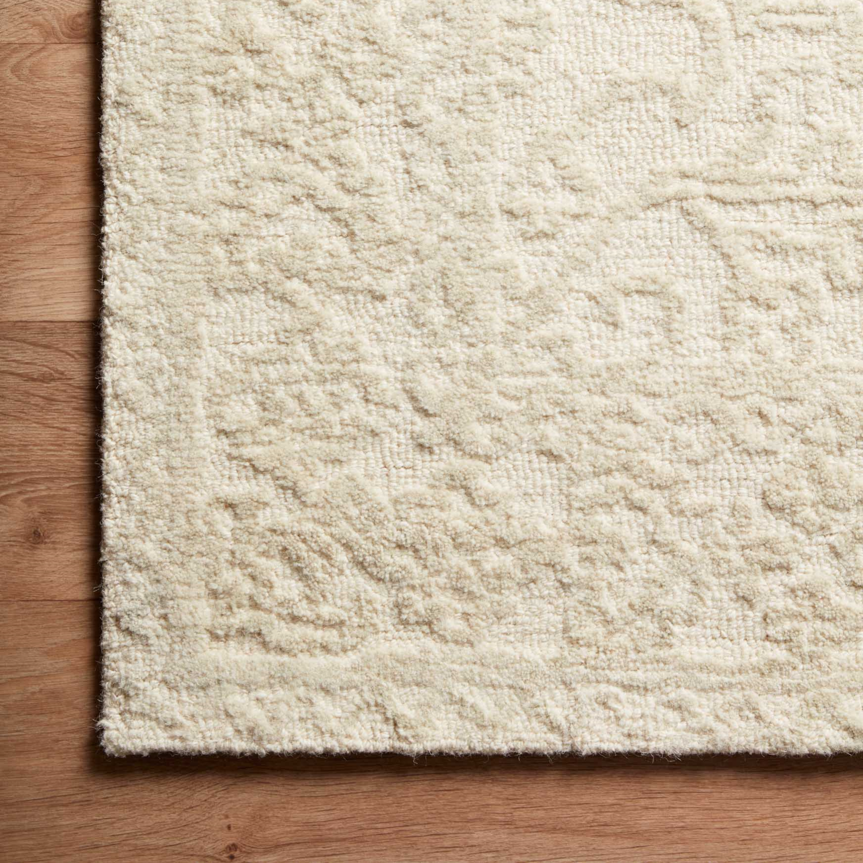 cream and light grey distressed rug with traditional detail