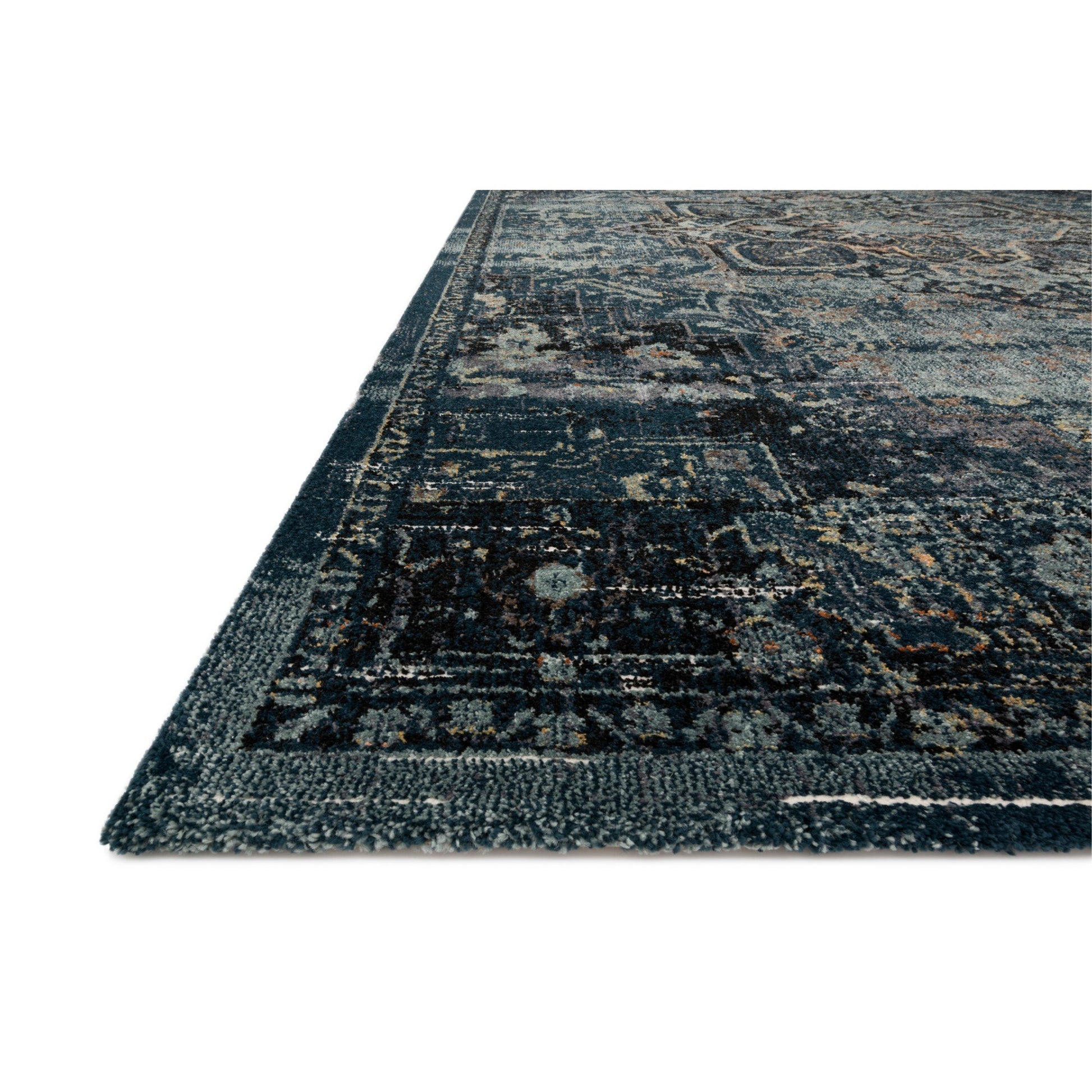 dark blue and ocean blue area rug with floral detail