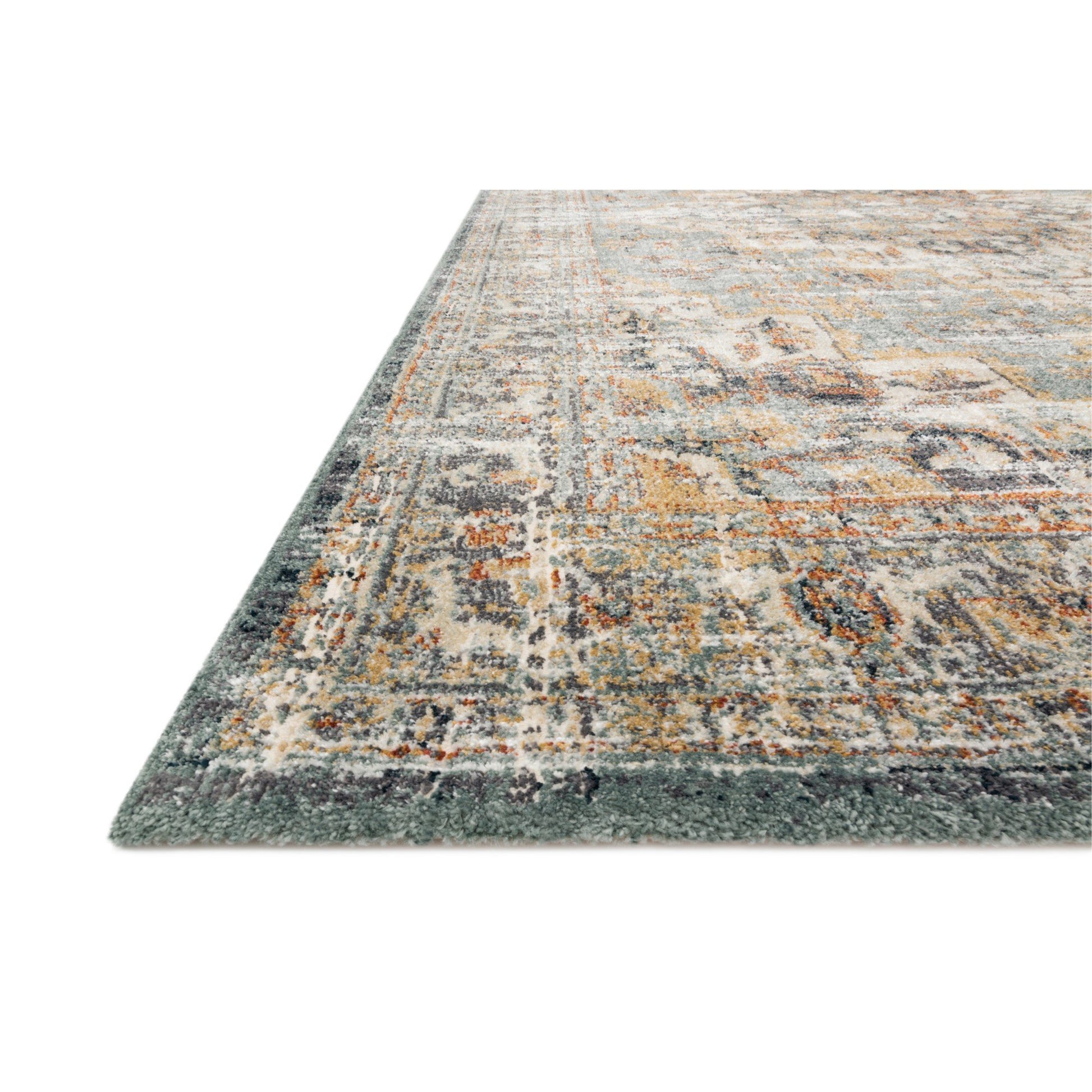 dark grey and blue traditional rug with distressed floral detail in gold and brown